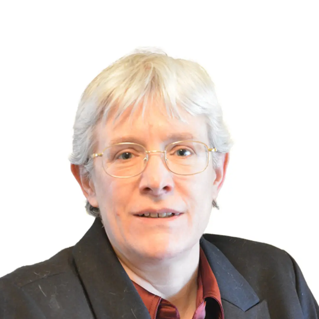 Person with glasses and short light hair.